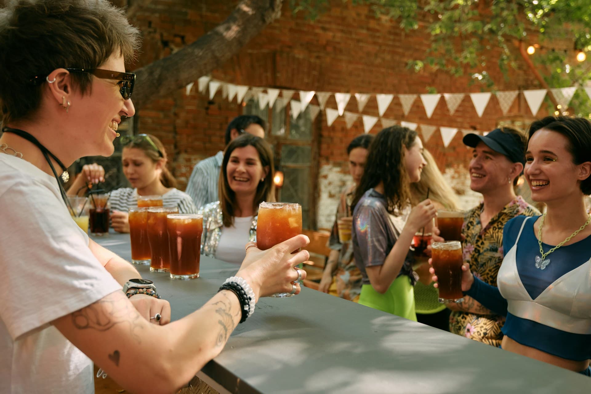 Friends enjoying drinks at an outdoor event